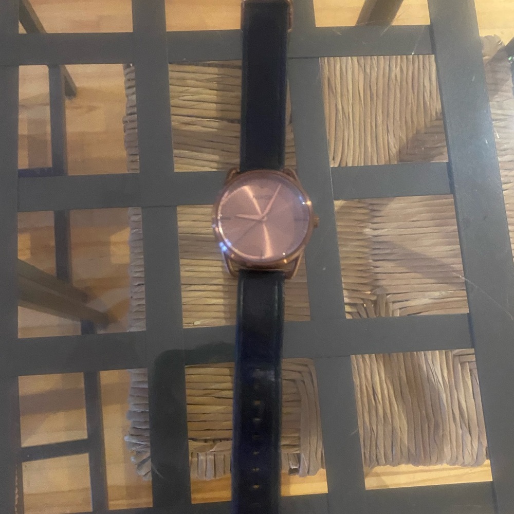 Rose gold and black Nixon watch